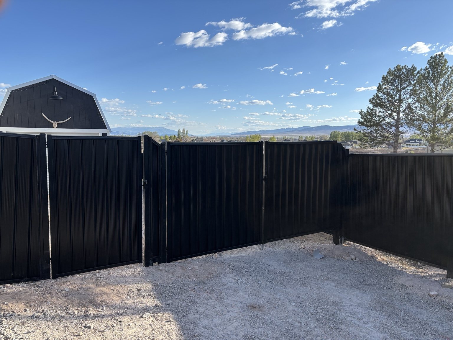 Black metal privacy fence and gates