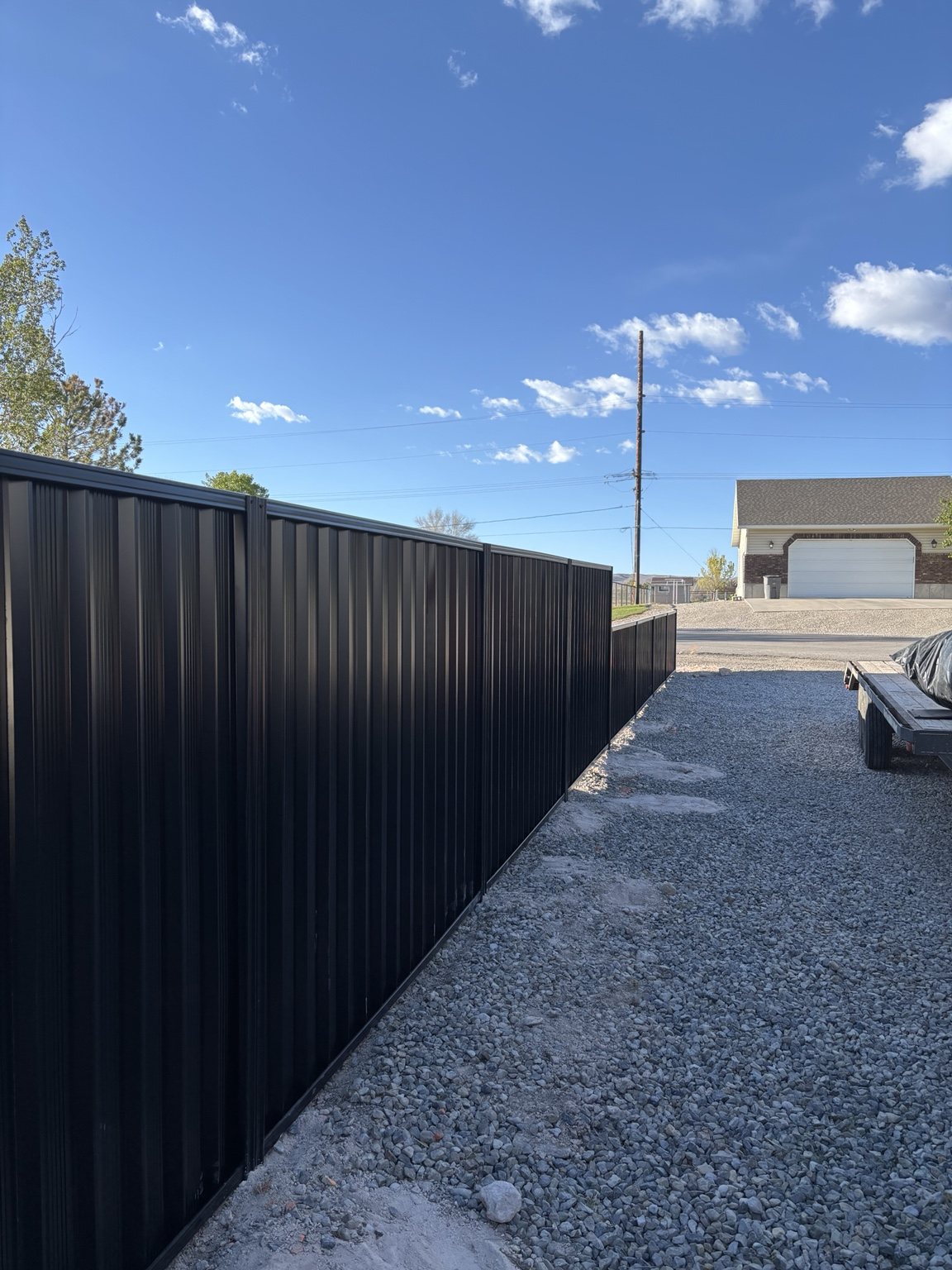 Black privacy fence line