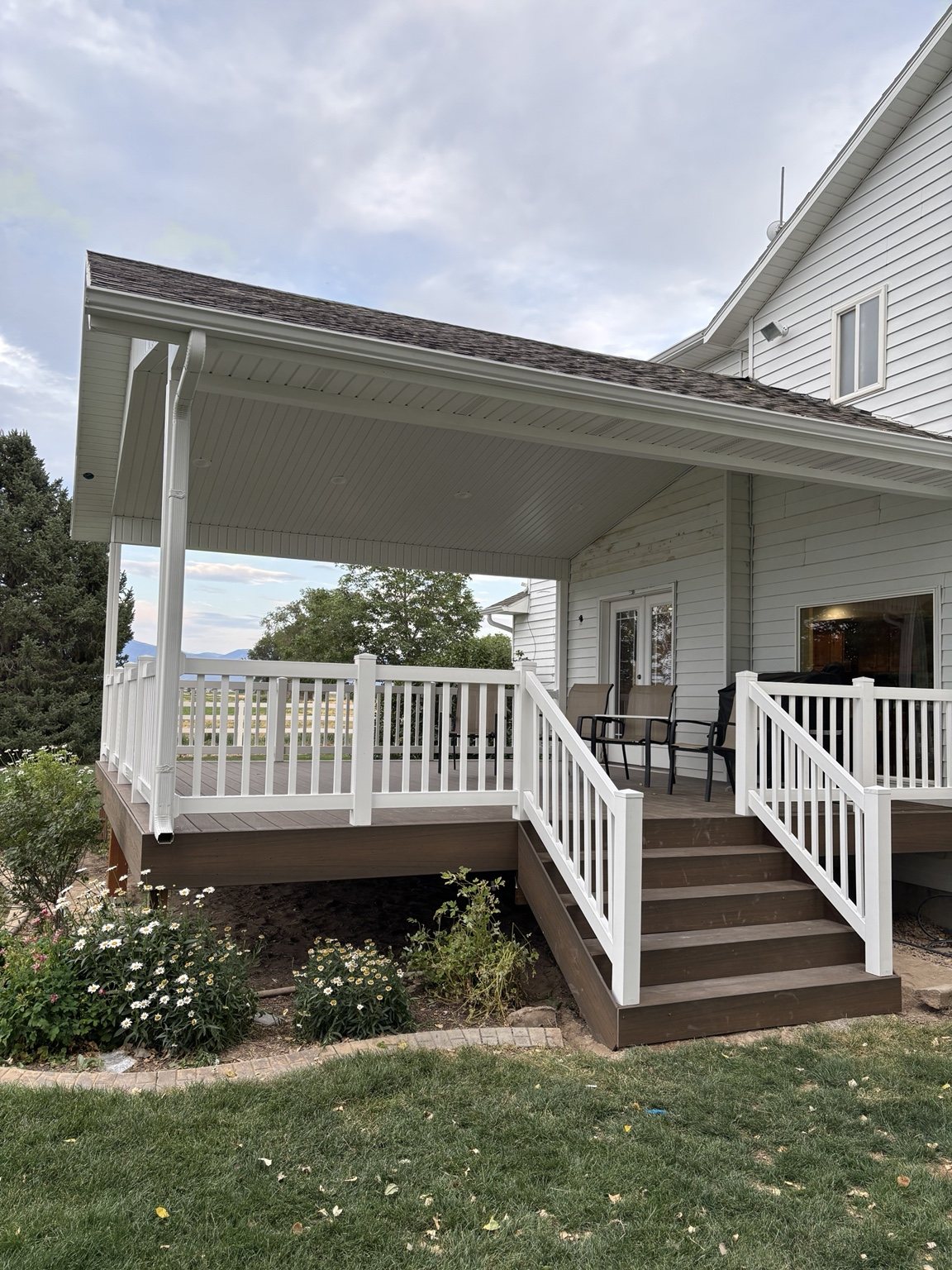 Covered deck with white railing