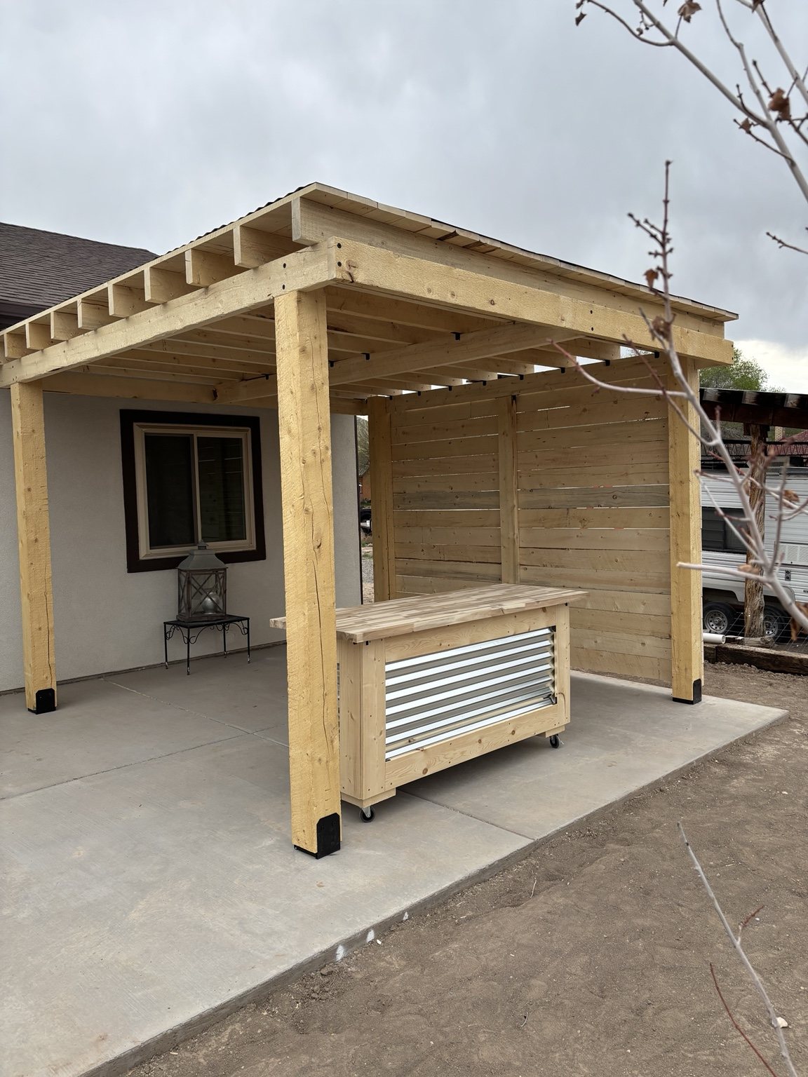Custom wood pergola with outdoor kitchen